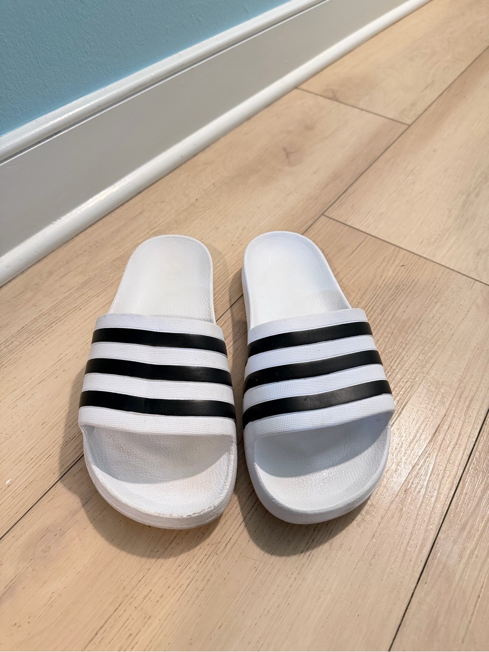 White Adidas Slides With Black Stripes